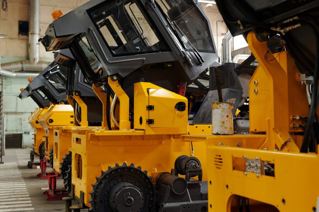 Perspective of several huge industrial machines standing in row